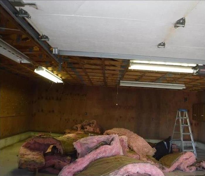 Garage with insulation piled on the floor